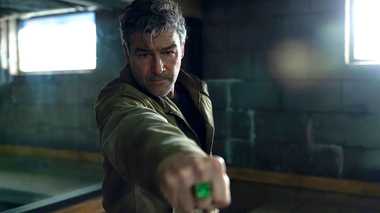 Hal Jordan, played by Kyle Chandler, pointing his power ring at something offscreen